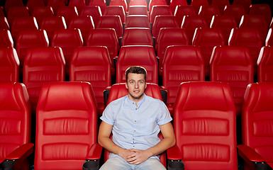 Image showing happy young man watching movie in theater