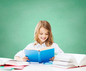 Image showing happy student girl reading book at school