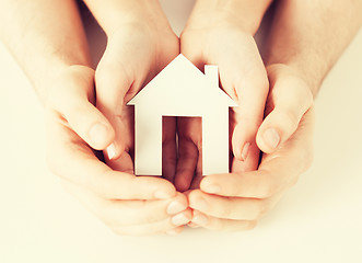 Image showing woman and hands with paper house