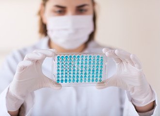 Image showing close up of scientist making test in lab