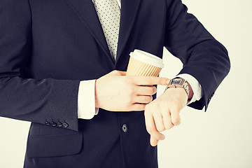 Image showing man looking at wristwatch