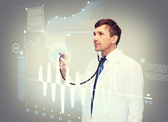 Image showing male doctor with stethoscope and cardiogram