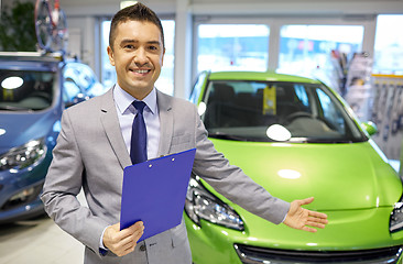 Image showing happy man at auto show or car salon