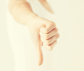 Image showing woman showing thumbs down