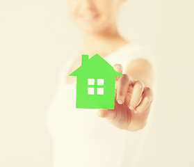 Image showing woman hands holding green house