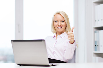 Image showing smiling businesswoman or student with laptop