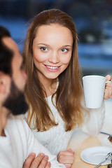 Image showing happy couple meeting and drinking tea or coffee