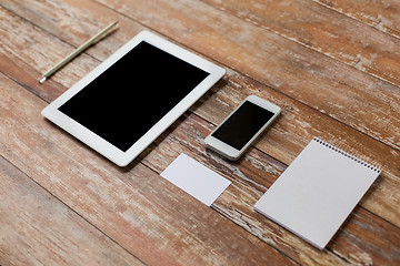 Image showing close up of notebook, tablet pc and smartphone