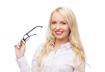 Image showing smiling businesswoman or secretary in office