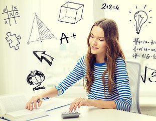 Image showing student girl with book, notebook and calculator