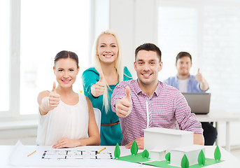 Image showing smiling architects working in office