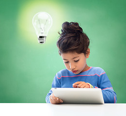 Image showing little girl with tablet pc at school