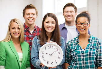 Image showing group of students at school with clock