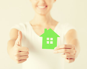 Image showing woman hands holding green house