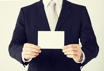 Image showing man hand with blank paper