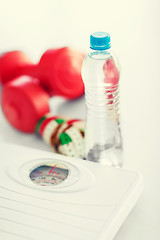 Image showing scales, dumbbells, bottle of water, measuring tape