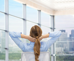 Image showing businesswoman sitting on chair from back