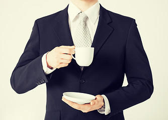 Image showing man looking at wristwatch