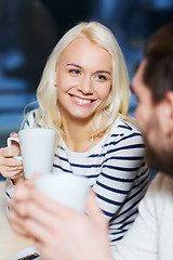 Image showing happy couple meeting and drinking tea or coffee