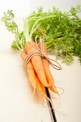 Image showing baby carrots bunch tied with rope