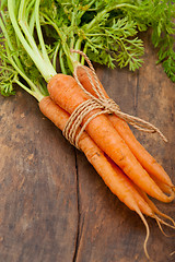 Image showing baby carrots bunch tied with rope