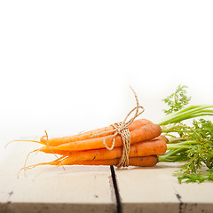 Image showing baby carrots bunch tied with rope