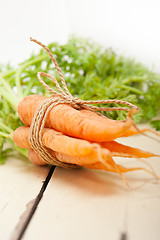 Image showing baby carrots bunch tied with rope