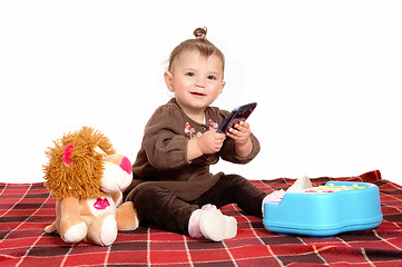 Image showing Baby playing with cell phone.