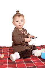 Image showing Baby girl sitting on blanket.