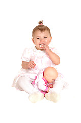 Image showing Baby girl sitting on floor.