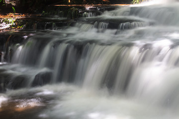 Image showing waterfall and rocks covered with moss