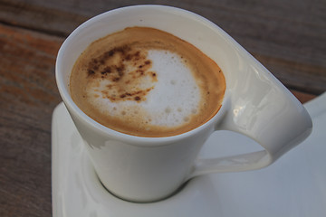 Image showing  cappuccino coffee on wooden table