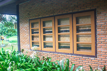 Image showing windows  on a red brick wall