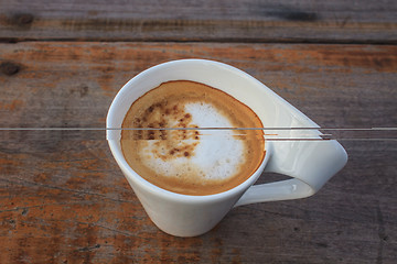 Image showing  cappuccino coffee on wooden table