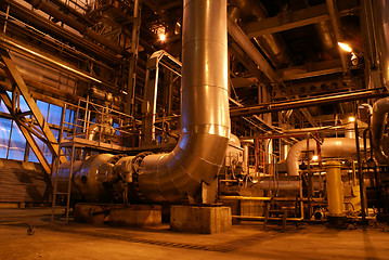 Image showing an assortment of different size and shaped pipes at a power plan