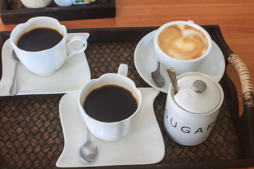 Image showing cappuccino and black  coffee on wooden table