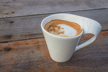 Image showing  cappuccino coffee on wooden table