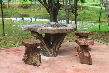 Image showing Wooden table and chairs in the garden