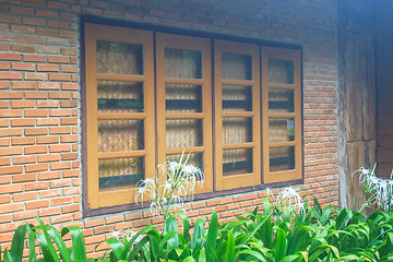 Image showing windows  on a red brick wall