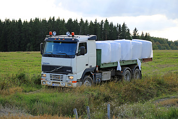 Image showing Flatbed Volvo FH12 Transports Silage Bales