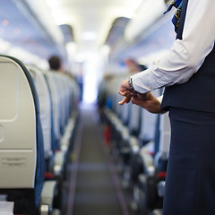 Image showing Stewardess on the airplane.