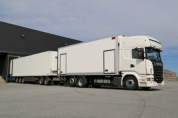 Image showing White Scania R560 Full Trailer Unloading at a Warehouse