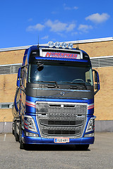 Image showing New Volvo FH Tank Truck by a Warehouse, Vertical View