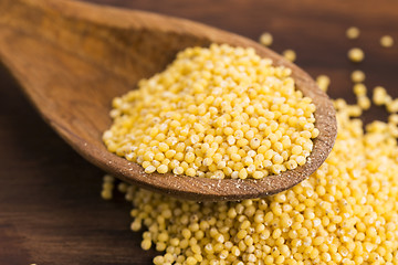 Image showing Millet on wooden spoon