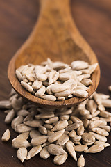 Image showing Sunflower seed with a wooden spoon