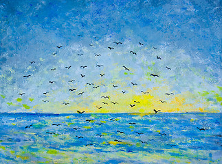 Image showing Sunset at the sea, birds in the sky