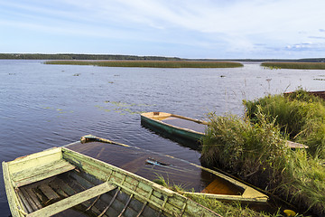 Image showing Old boats in nothern wild lake 