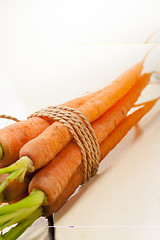 Image showing baby carrots bunch tied with rope