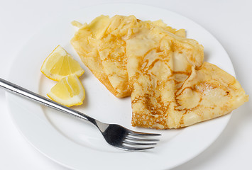 Image showing English pancake and lemon