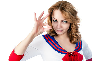 Image showing Pretty sailor shows ok gesture